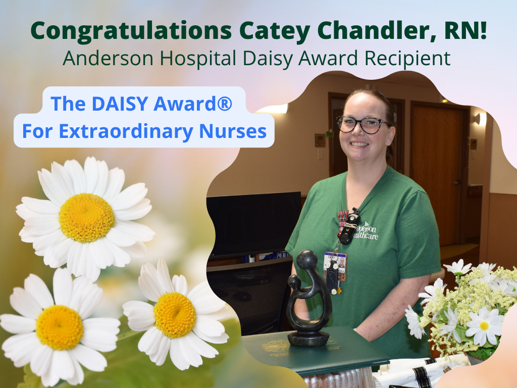 A nurse in green scrubs smiles next to a DAISY Award trophy and flowers. Text reads, “Congratulations Catey Chandler, RN! Anderson Hospital Daisy Award Recipient. The DAISY Award® For Extraordinary Nurses.” Daisies decorate the image.