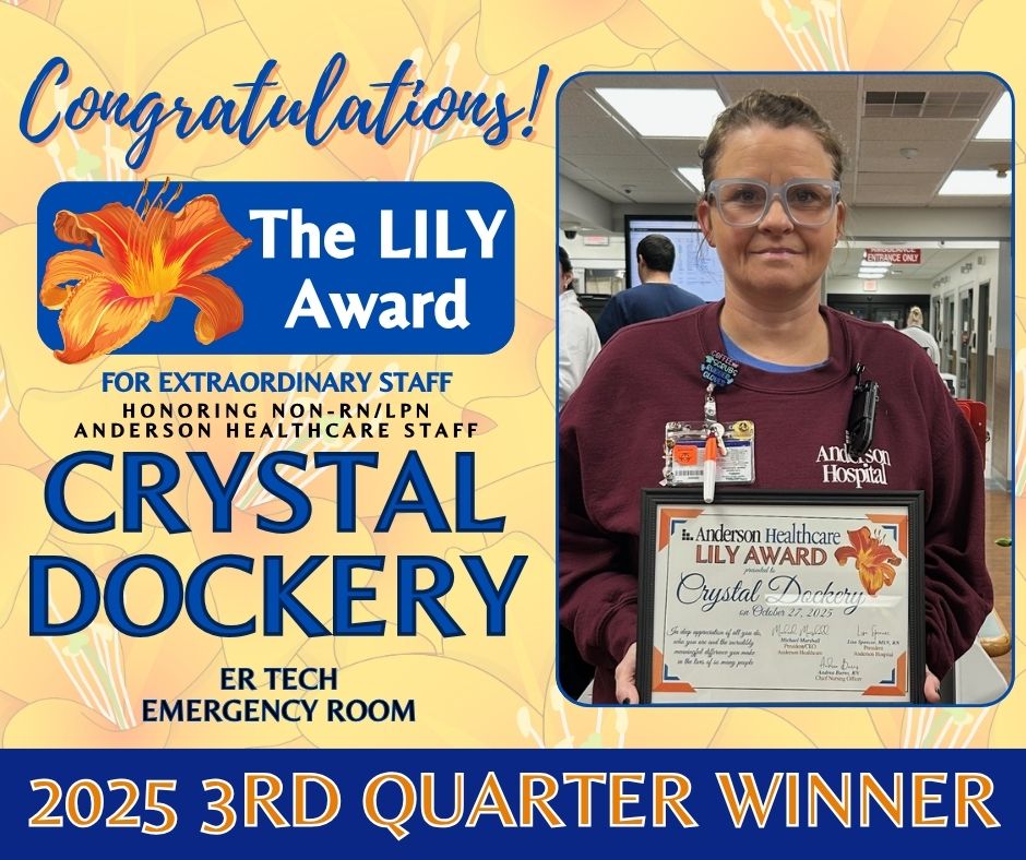 A woman wearing glasses and scrubs stands in a hospital, holding a framed certificate. Text announces Crystal Dockery as the 2023 3rd Quarter Winner of The LILY Award for Anderson Healthcare Staff.