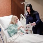 Nurse at Anderson Hospital reviewing treatment brochure with patient