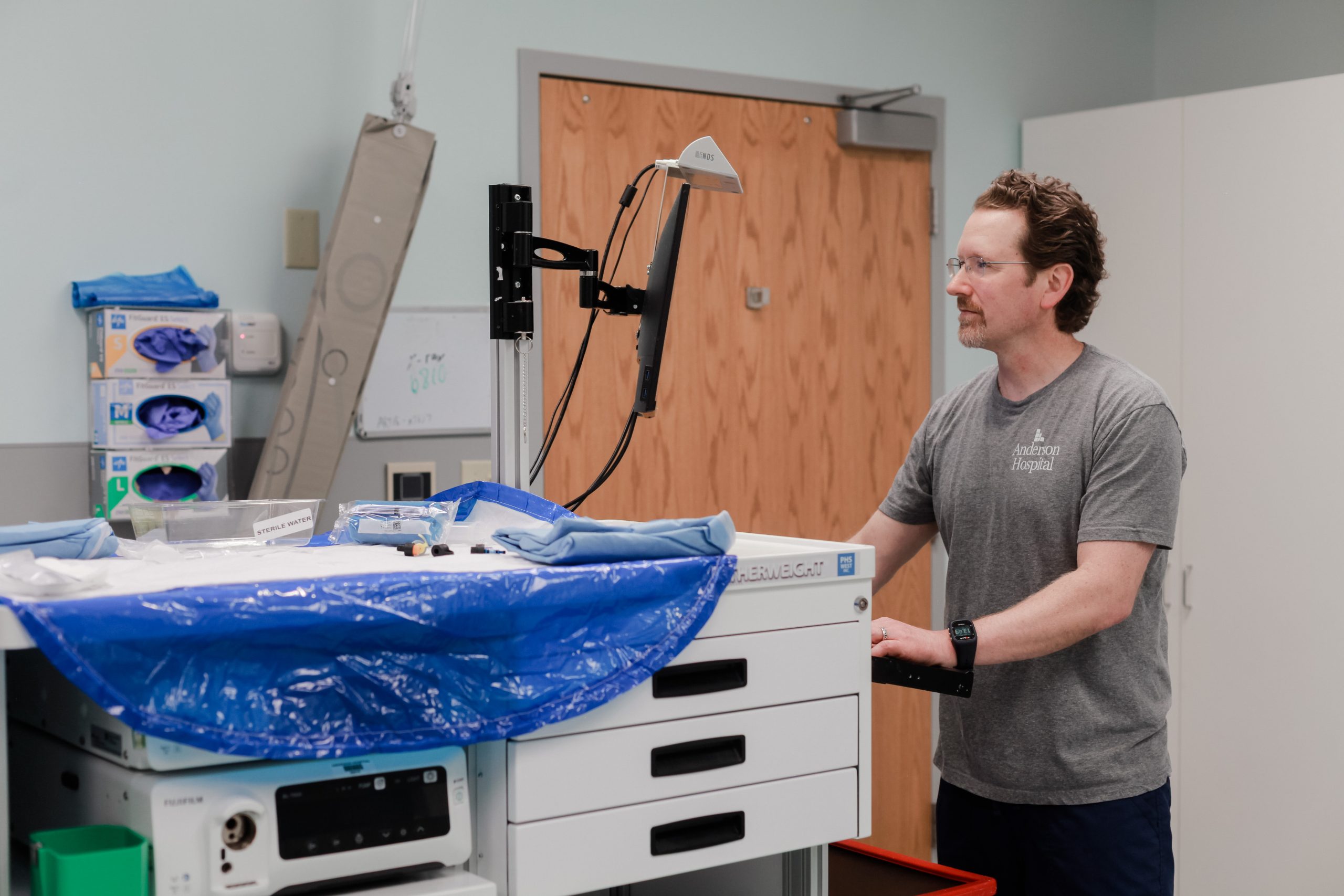 Nurse at Anderson Hospital examining endoscopic results on computer