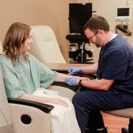 Nurse preparing patient for a blood drawing at Anderson Hospital